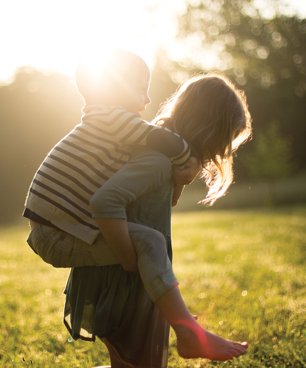 little kids piggybacking on palmwoods land for sale