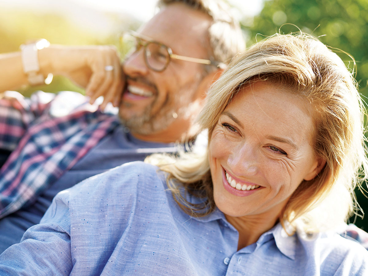 middle aged couple smiling when they buy palmwoods land